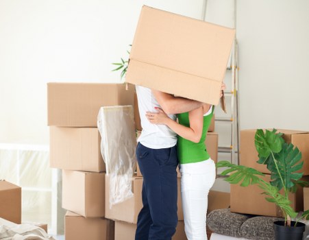 Packed moving boxes ready for collection in a Tooting home
