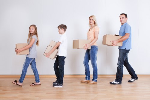 Family moving items into a self storage space in Tooting