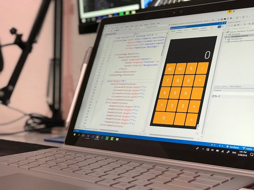A person seated at a desk in a bright indoor environment is engaged in a home relocation project, using a laptop displaying lines of code or data. On the desk, there is a document with the heading 'FU